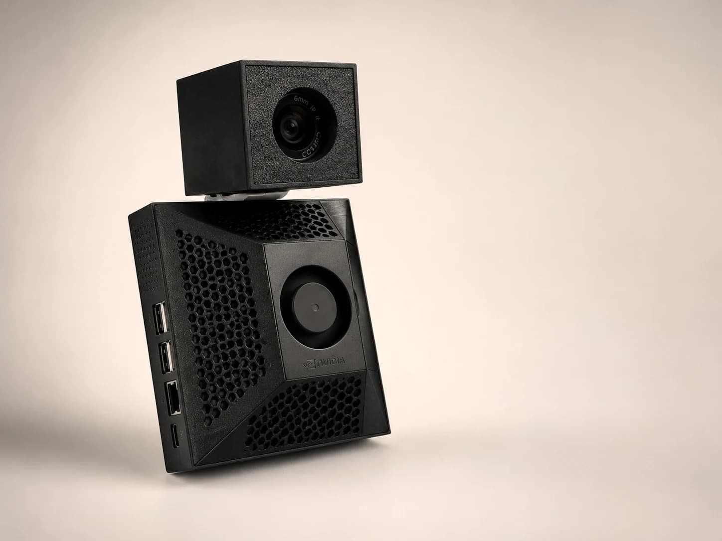 The Presently prototype: a compact compute unit with vented housing and a detachable camera module mounted on top
